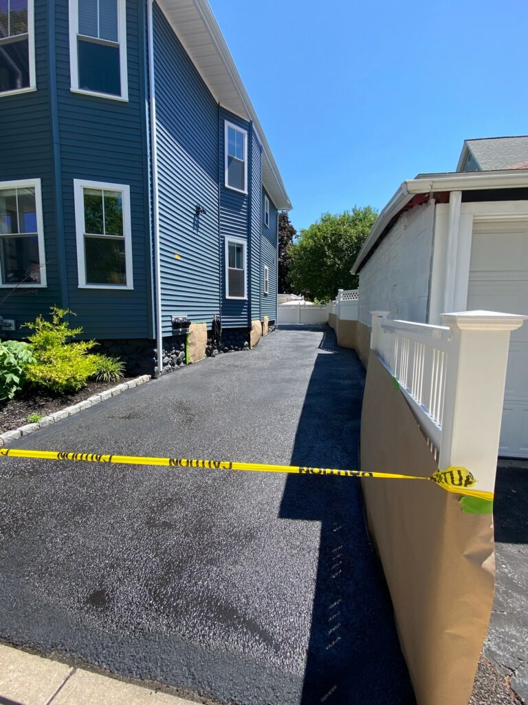 Driveways professionally seal coated in Medford, Massachusetts